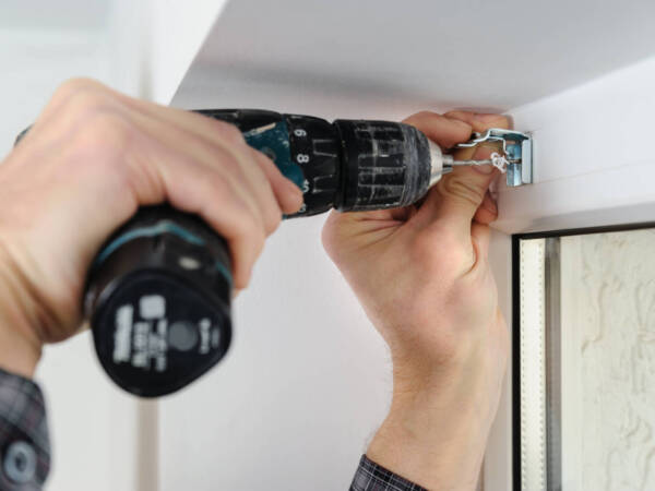 Installing,Wooden,Blinds.,A,Man,Drill,Hole,For,Fastening,Metal